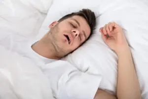 Man snoring from sleep apnea. 