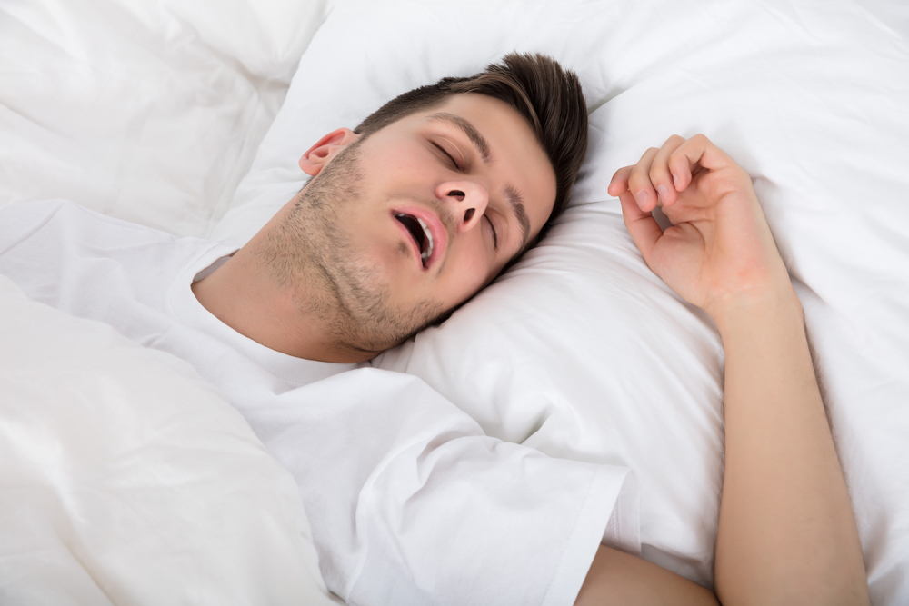 Man snoring from sleep apnea.