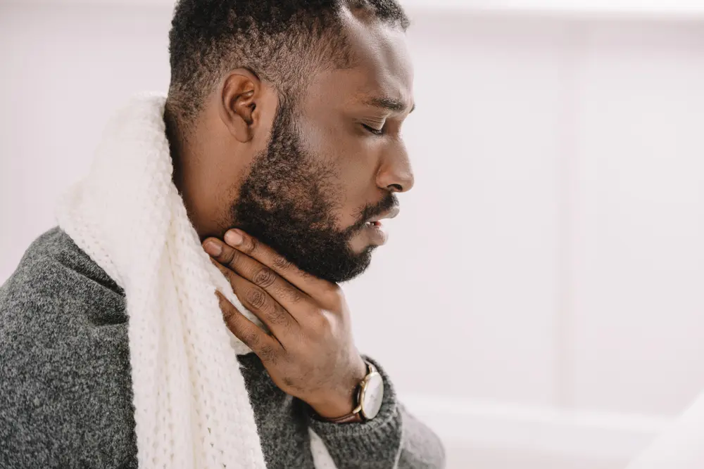 Man suffering from tonsil stones.