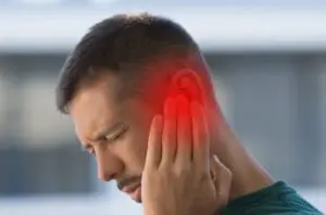 person with ruptured eardrum. 