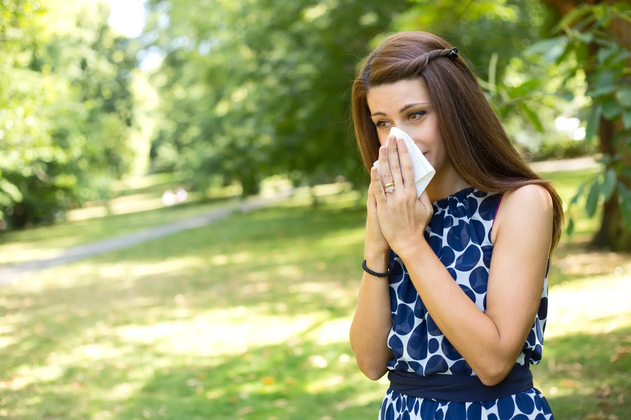 Woman blowing her noise.