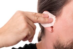 Man bleeding from his ears.